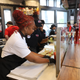 Pinky Cole works the line with the staff at Slutty Vegan.